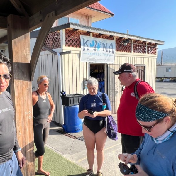 a group of people standing in front of a building