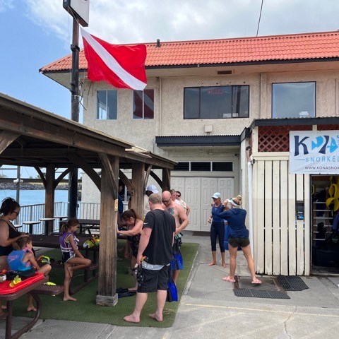 a group of people standing in front of a building