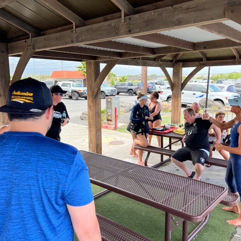 a group of people sitting at a train station