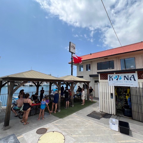 a group of people standing in front of a building