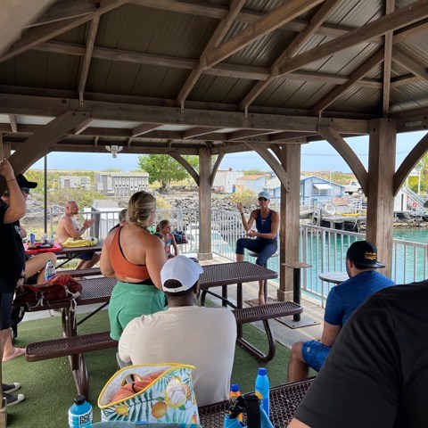 a group of people sitting at a table
