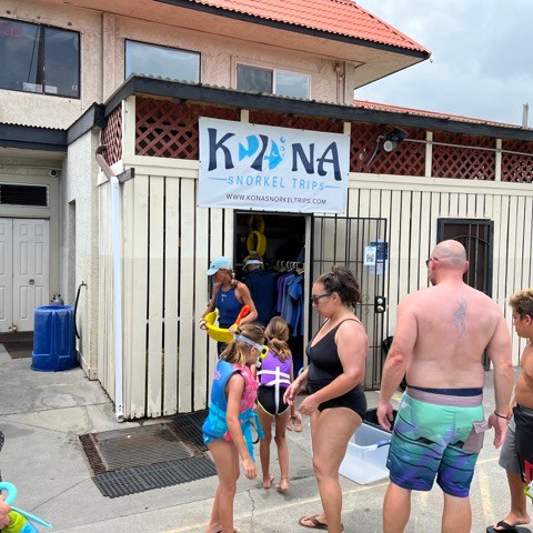 a group of people standing in front of a building