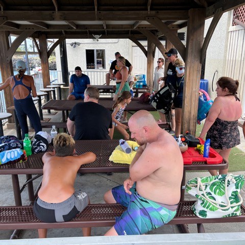 a group of people sitting at a table