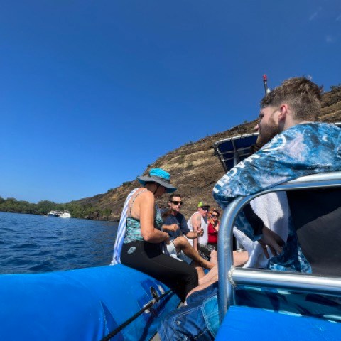 a man riding on the back of a boat