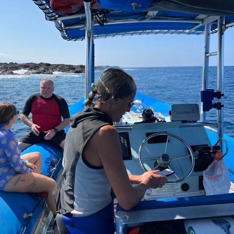 a group of people in a boat on a body of water