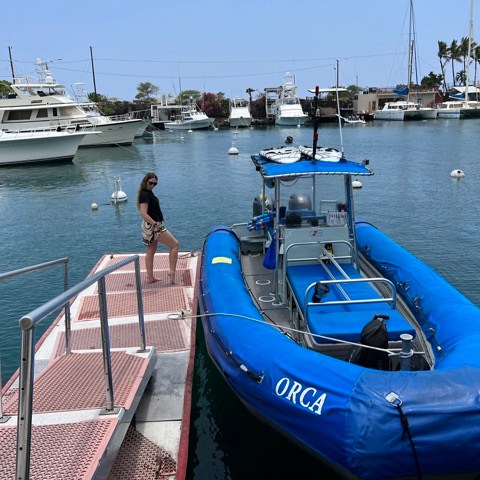a boat is docked next to a body of water