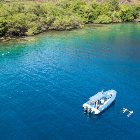 a small boat in a body of water