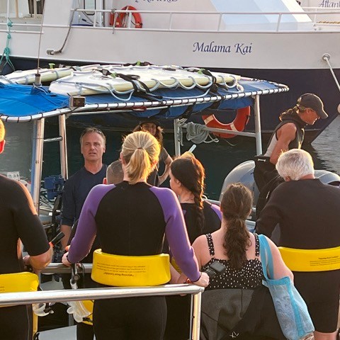 a group of people standing in front of a crowd