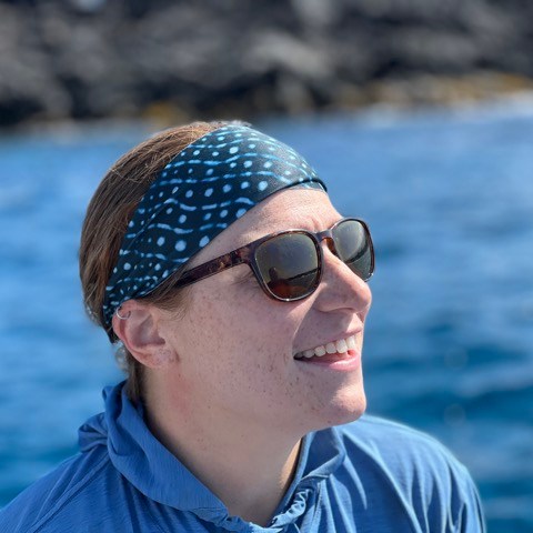 a man holding a fish in the water