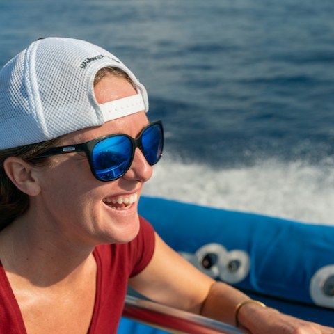 a person riding on the back of a boat