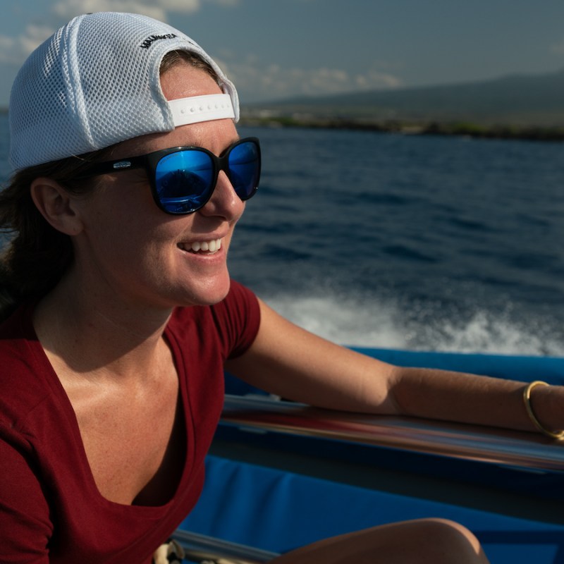 a person sitting on a boat in the water