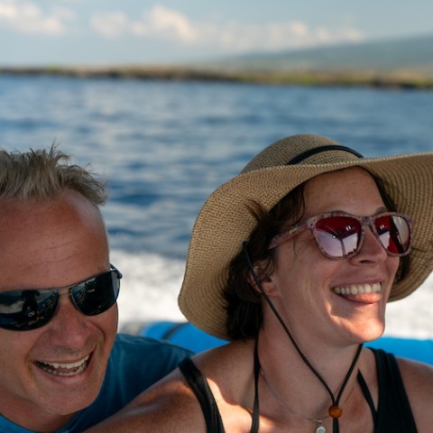 a person wearing sunglasses in a body of water