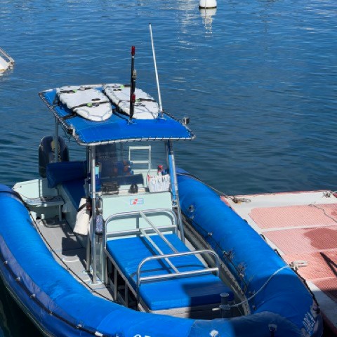 a boat is docked next to a body of water