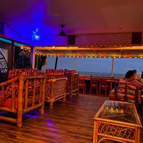a group of people sitting at a table in a room