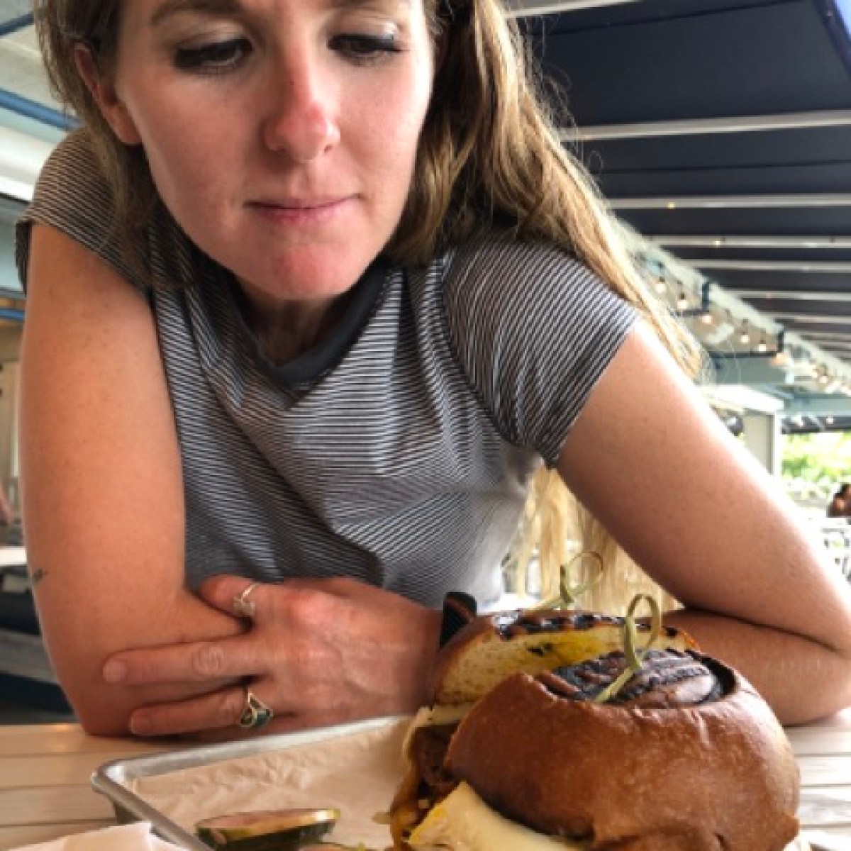 a person sitting at a table eating food