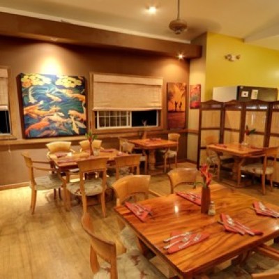 a living room filled with furniture and a fire place