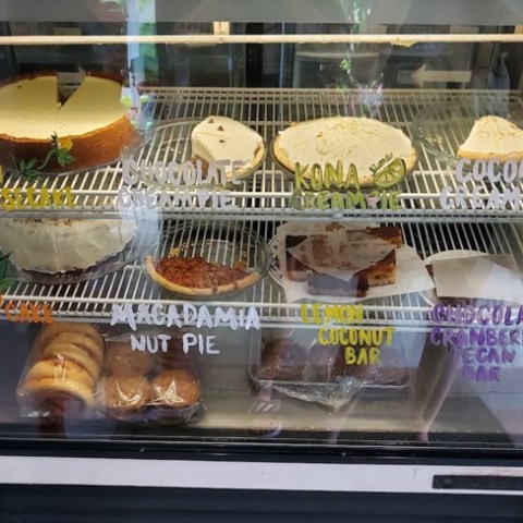 a glass display case filled with different types of food