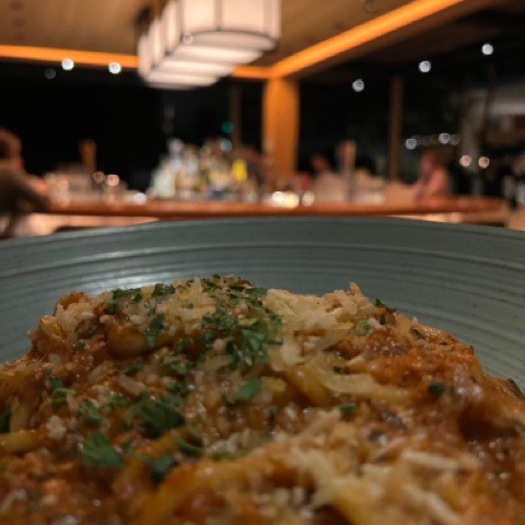 a pizza sitting on top of a plate of food