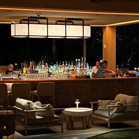 a group of people sitting at a table in a room