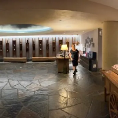 a living room filled with furniture and a large window