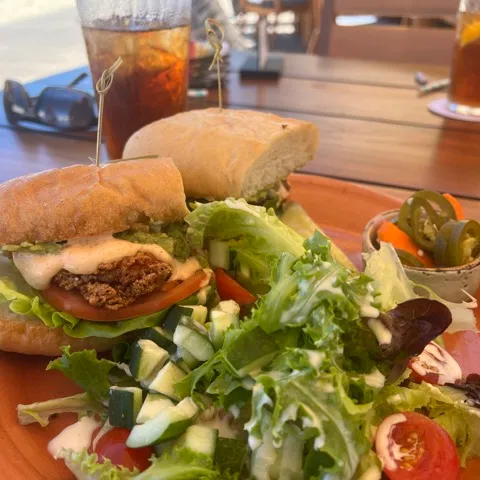 a plate of food with a sandwich and a salad