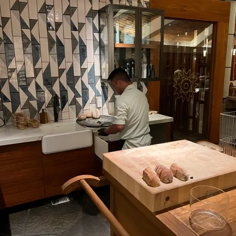 a person sitting at a table in a room