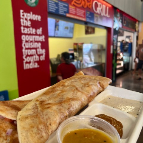 a plate with a sandwich and a cup of coffee