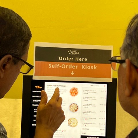 a person standing in front of a mirror posing for the camera