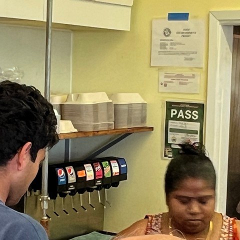 a man sitting at a table in a restaurant
