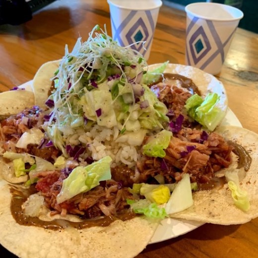 a sandwich sitting on top of a wooden table