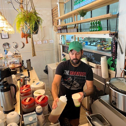 a person cooking in a kitchen preparing food