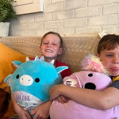 a little girl holding a teddy bear