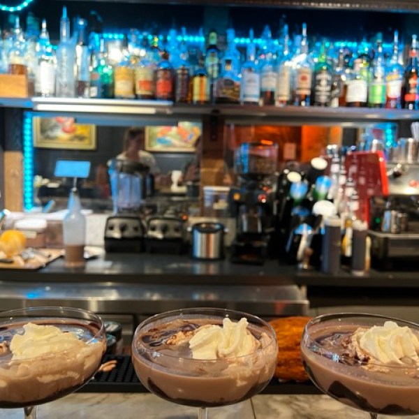 a closeup of 3 chocolate martinis on a bar
