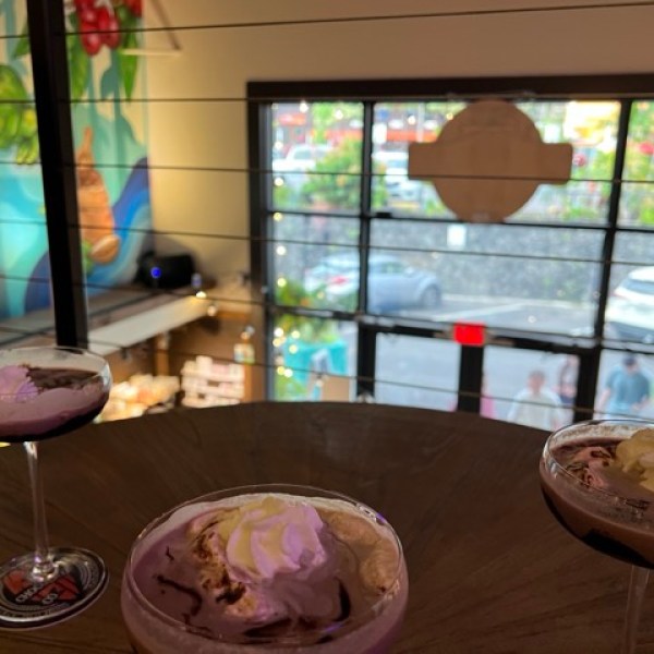 3 chocolate martinis on a table inside a store
