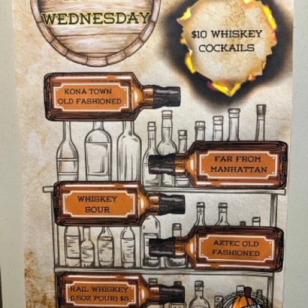 A poster saying whiskey Wednesdays $10 whiskey cocktails