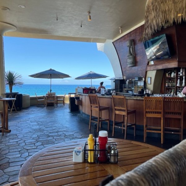 a room filled with furniture and a pool of water