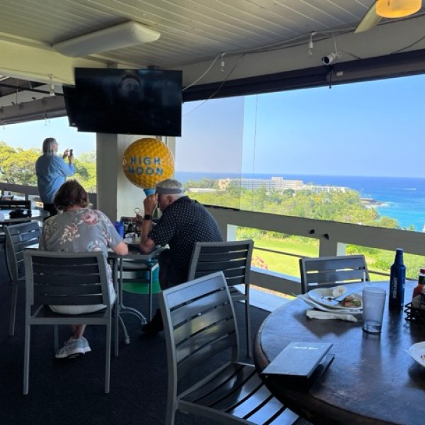 a group of people sitting at a table in a restaurant