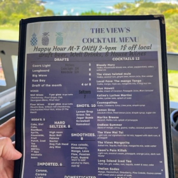 happy hour menu with a table and view behind