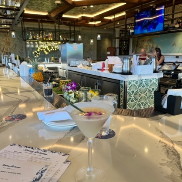 a person sitting at a table in a restaurant